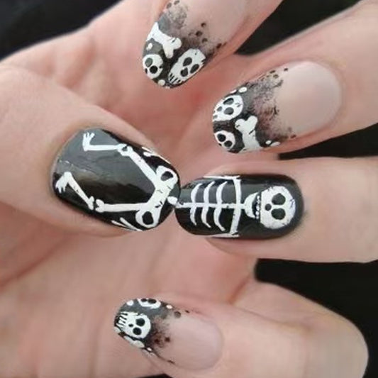 Spooky Season Medium Oval Black Skeleton Press On Nail Set with Unique Skull and Bone Design