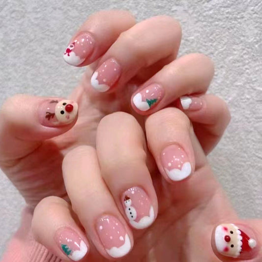 Nails with Christmas-themed designs on a light background