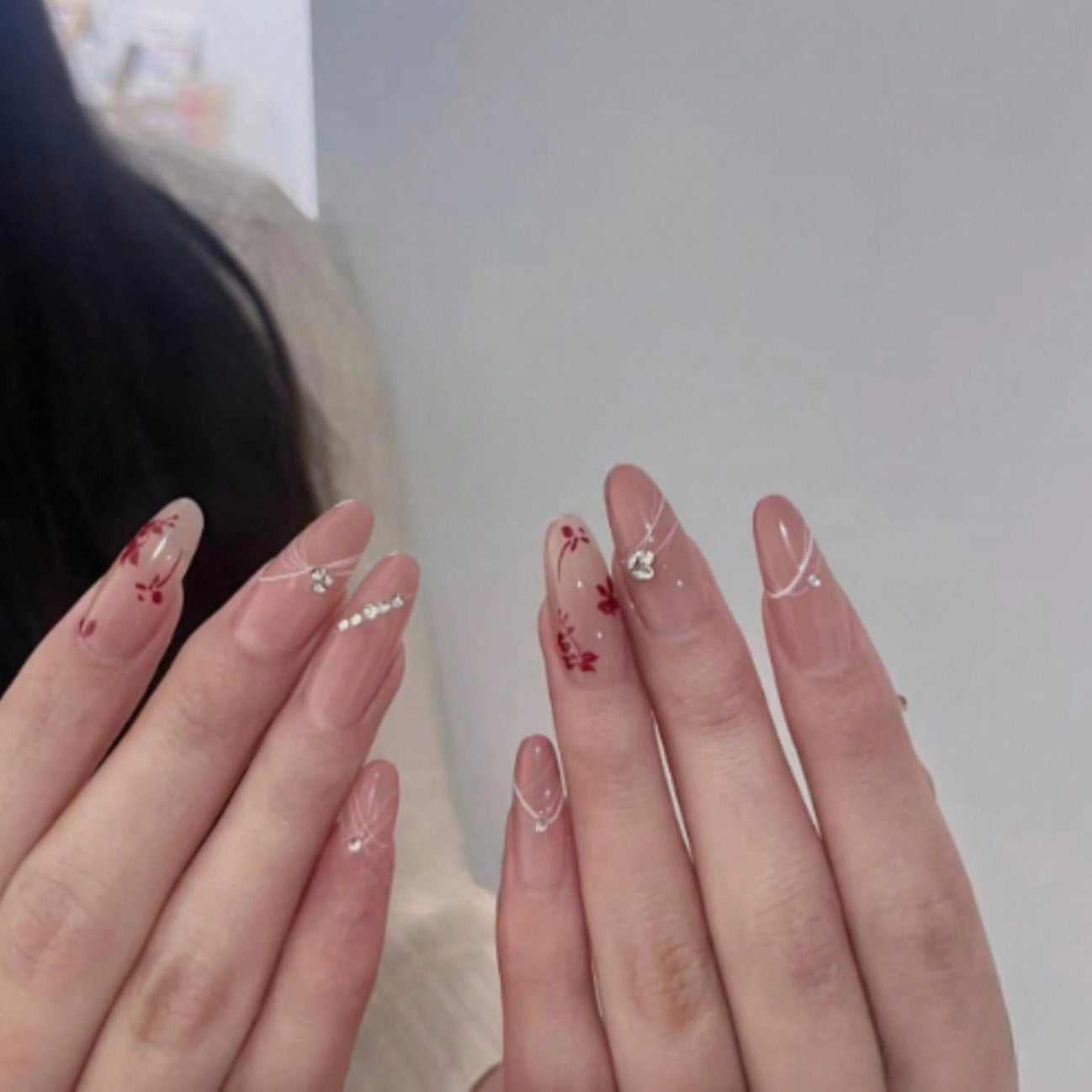 Floral Elegance Extra Long Almond Shaped Beige Press On Nail Set with Red Flower Accents and Sparkling Gems