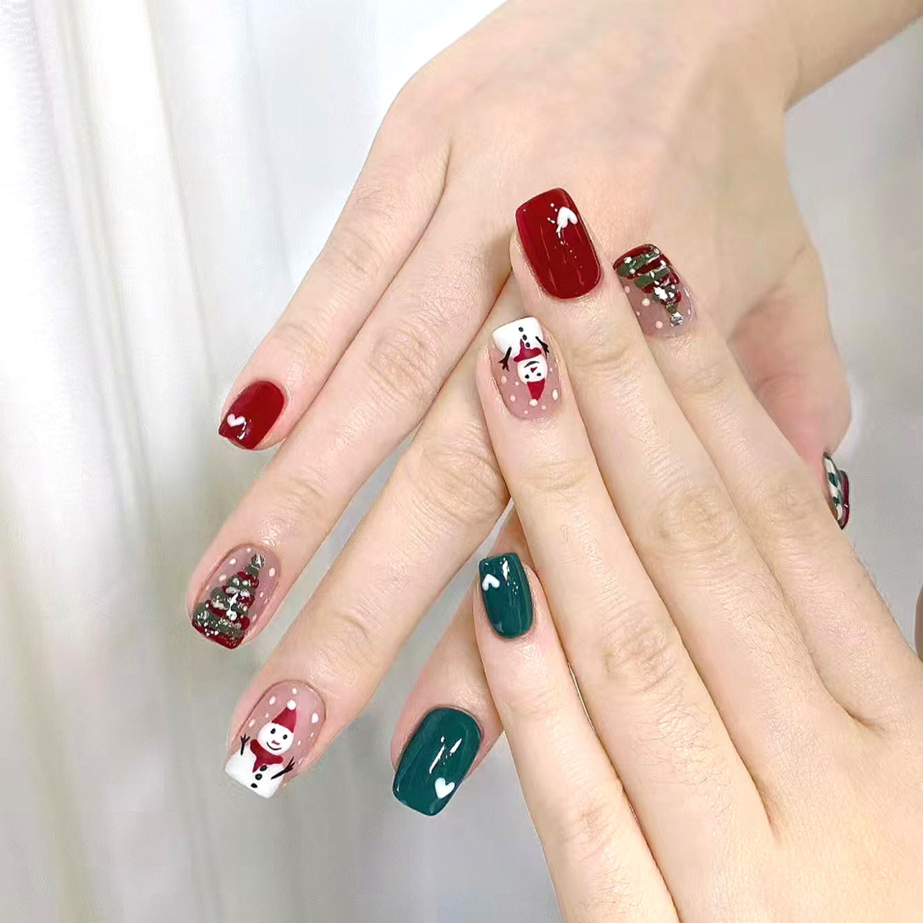 Festive Winter Wonderland Medium Square Press On Nail Set in Red Green White Featuring Cute Snowman and Christmas Tree Designs