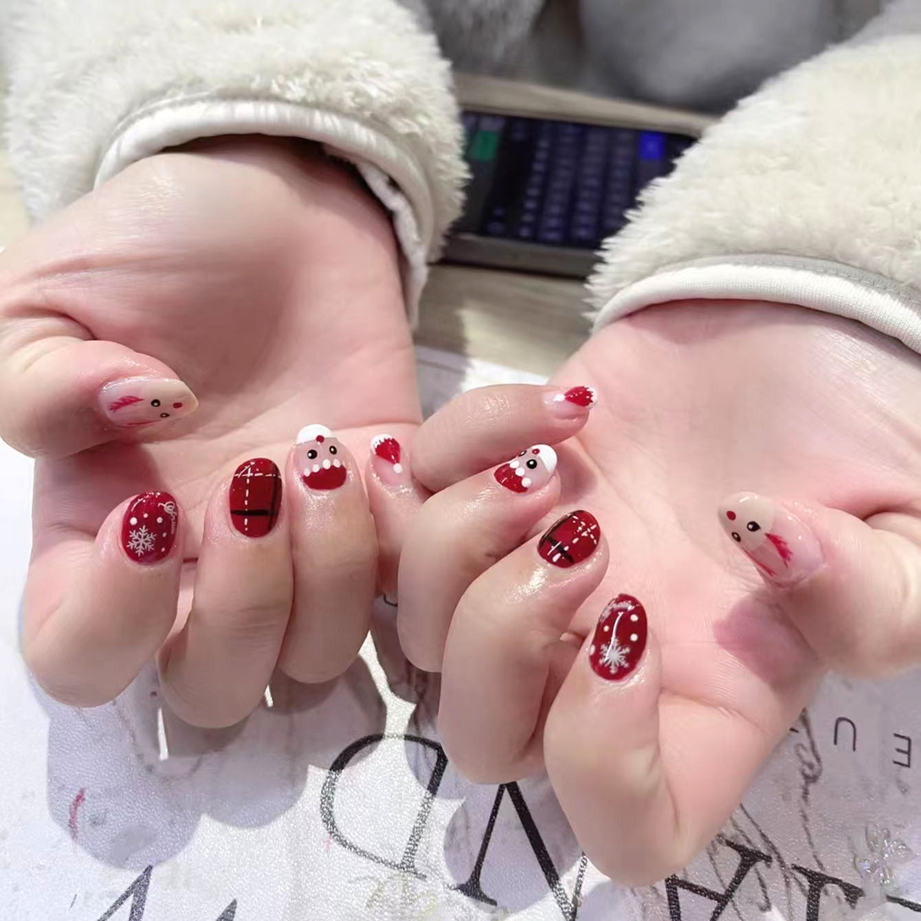 Festive Holiday Wonderland Short Oval Red and White Press On Nail Set with Cute Santa and Snowflake Designs