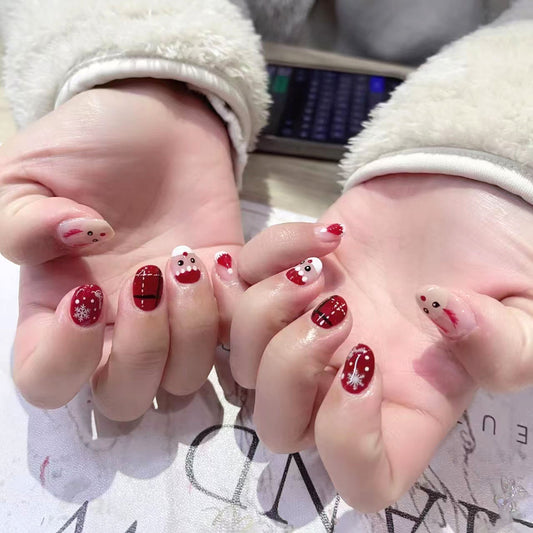 Festive Holiday Wonderland Short Oval Red and White Press On Nail Set with Cute Santa and Snowflake Designs