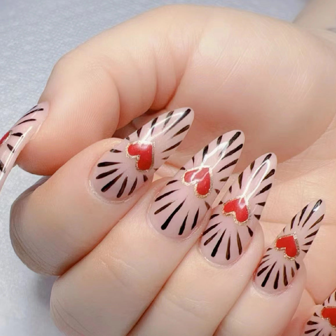Romantic Heartbeat Long Almond Clear Red and Black Nail Art with Shimmering Heart Accents