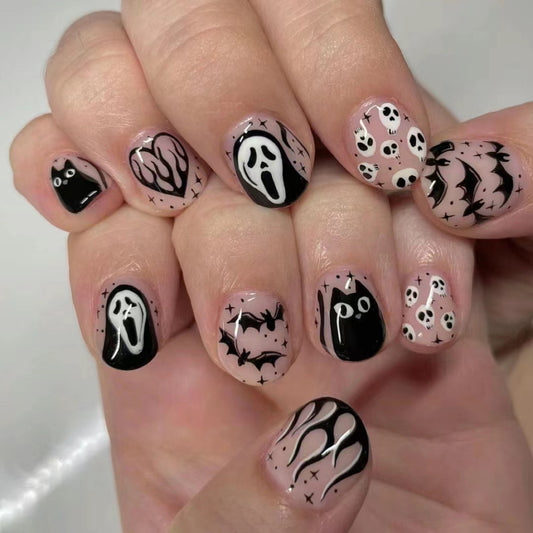 Spooky Halloween Short Oval Black And Beige Press On Nail Set With Ghosts Bats And Skulls Design