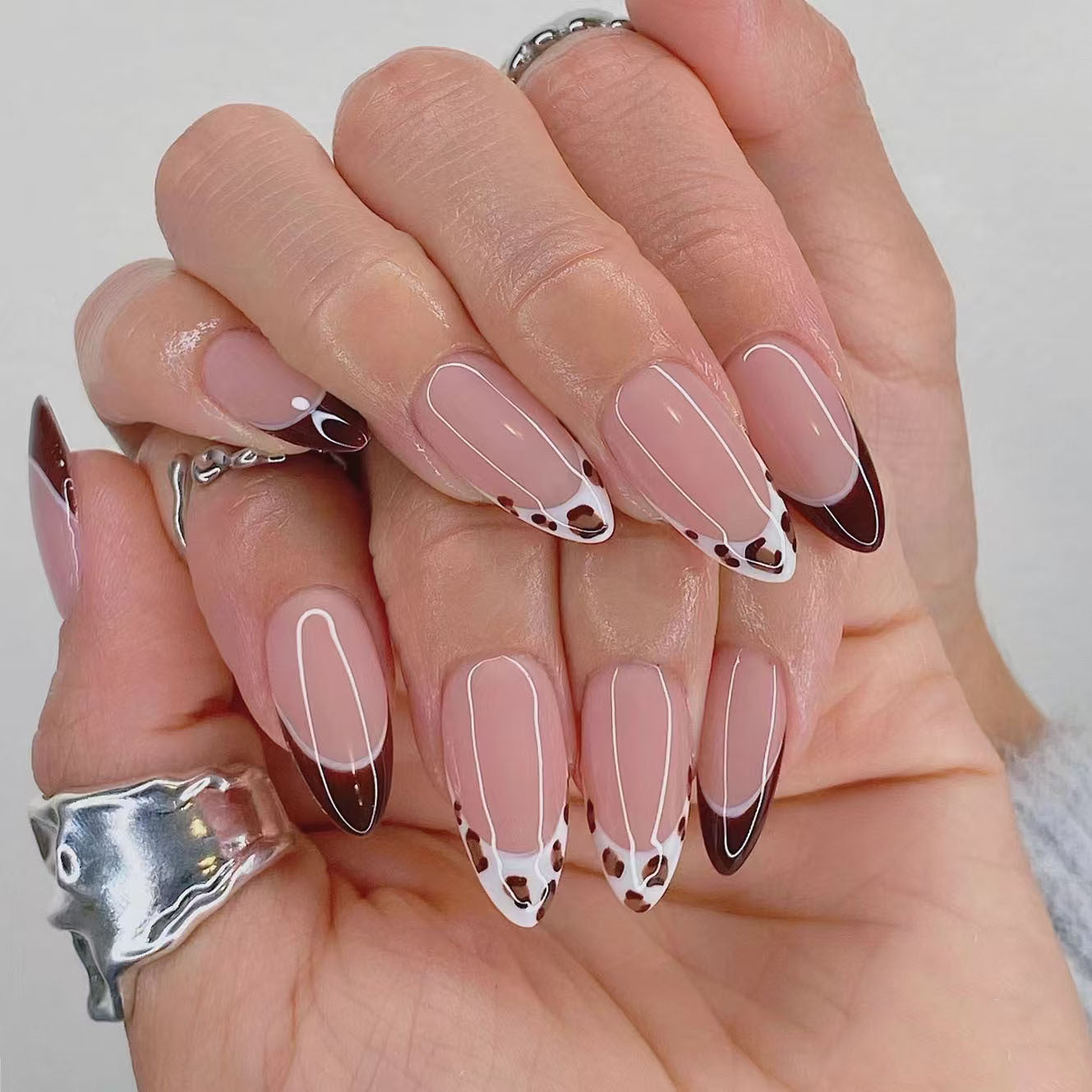 Chic Animal Print Medium Almond Press On Nail Set featuring Elegant Shape in Soft Pink and Rich Brown with Unique Spot Design