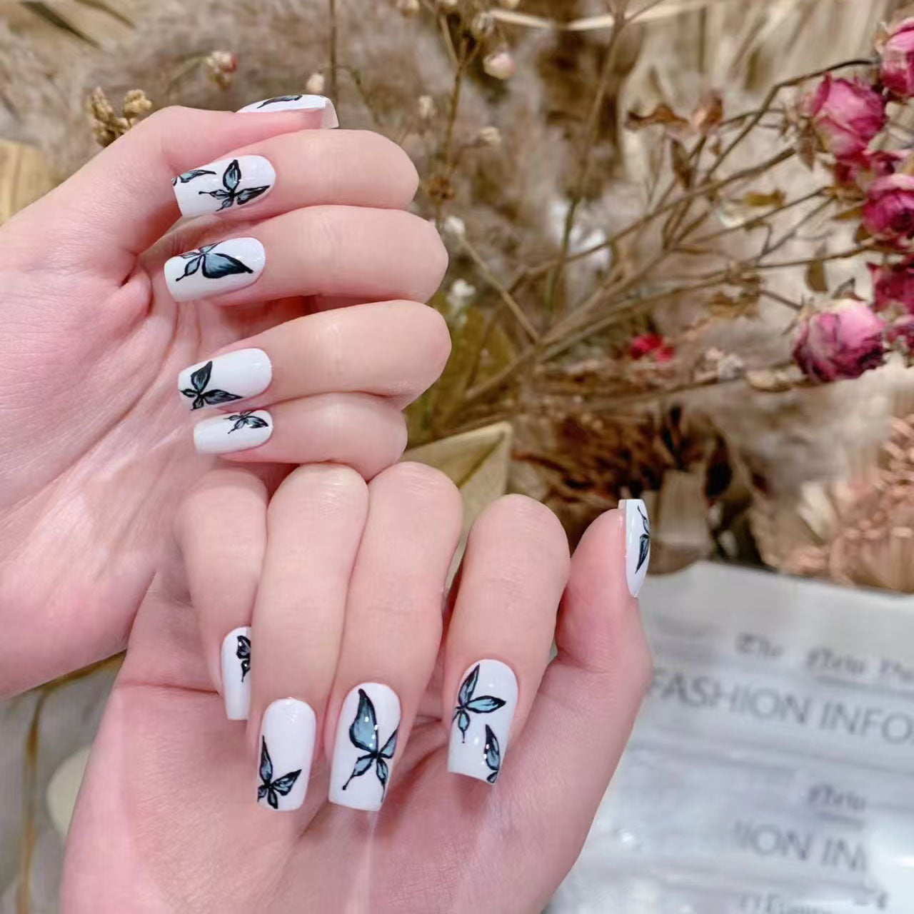 Whimsical Elegance Medium Square White Nail Set with Delicate Black Leaf Design