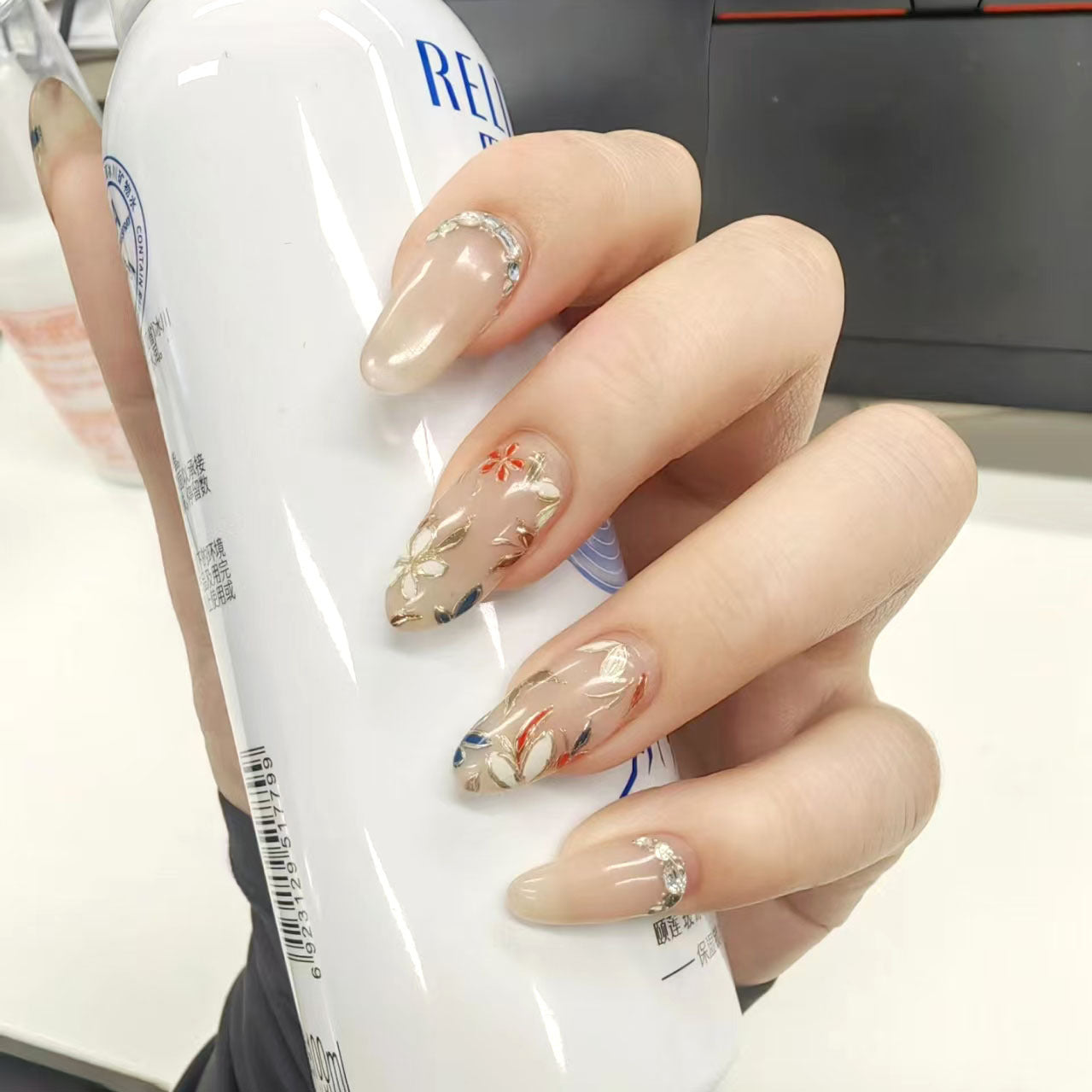 Botanical Elegance Long Almond Beige Press On Nail Set with Floral Design and Sparkling Accent