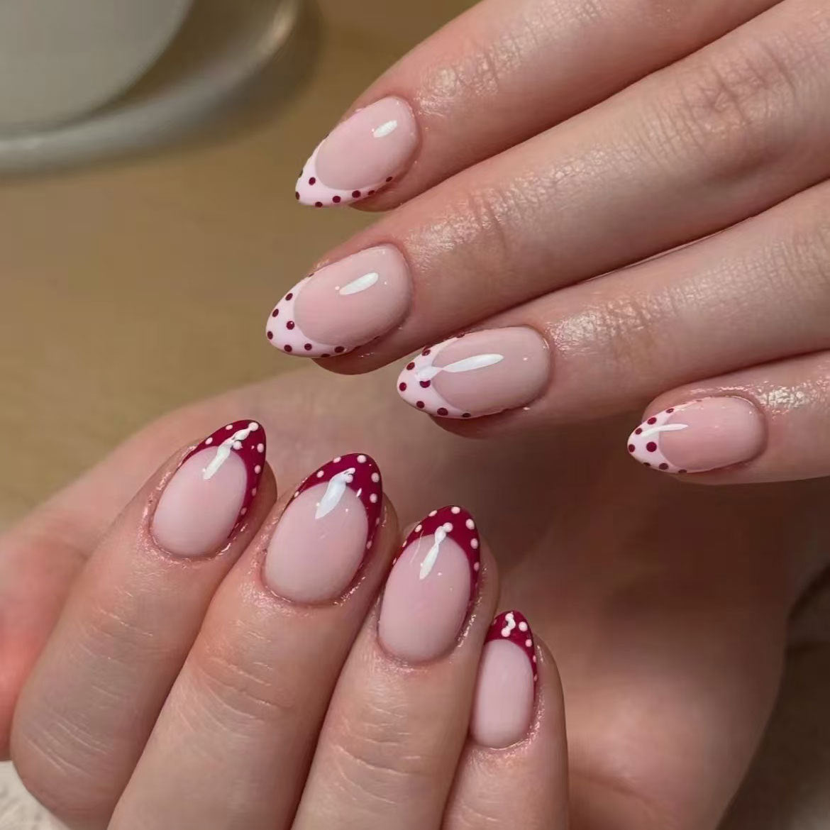 Sweet Strawberry Delight Short Oval Pink and Burgundy Press-On Nail Set with Charming Polka Dots