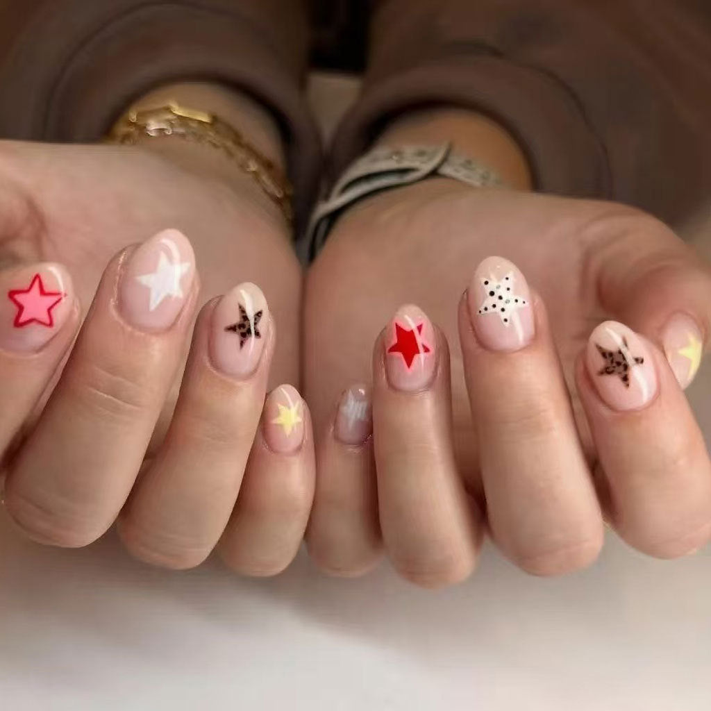 Whimsical Starry Night Medium Almond Shaped Pink Press On Nail Set with Colorful Star Accents