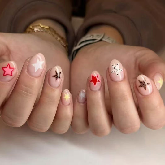 Whimsical Starry Night Medium Almond Shaped Pink Press On Nail Set with Colorful Star Accents