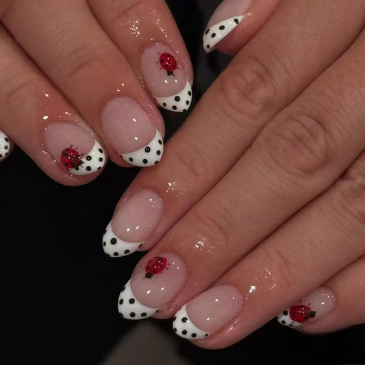 Charming Garden Delight Medium Oval Shaped White and Black Polka Dot Press On Nail Set with Vibrant Ladybug Accents