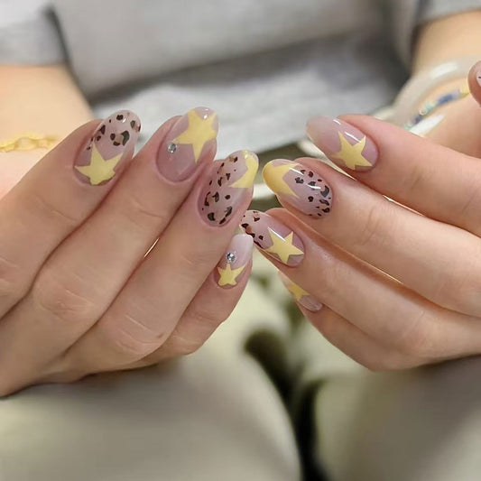 Celestial Chic Medium Oval Shaped Press On Nail Set in Soft Pink and Lemon Yellow with Star and Leopard Print Design