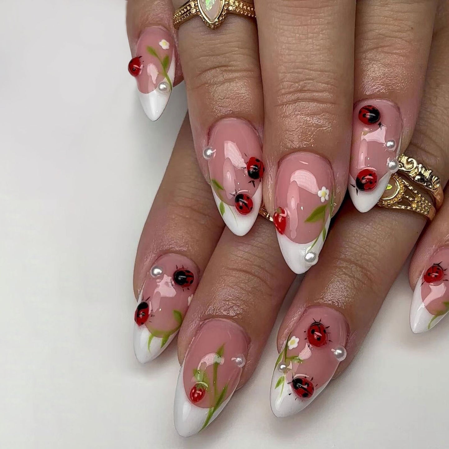 Garden Delight Long Almond Glossy Pink Nails with Ladybug and Floral Accents
