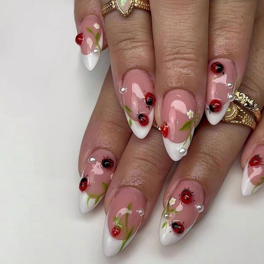 Garden Delight Long Almond Glossy Pink Nails with Ladybug and Floral Accents