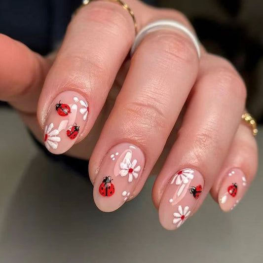 Ladybug Picnic Short Oval Beige Press-On Nail Set Featuring Vibrant Red Insect Designs with Floral Accents