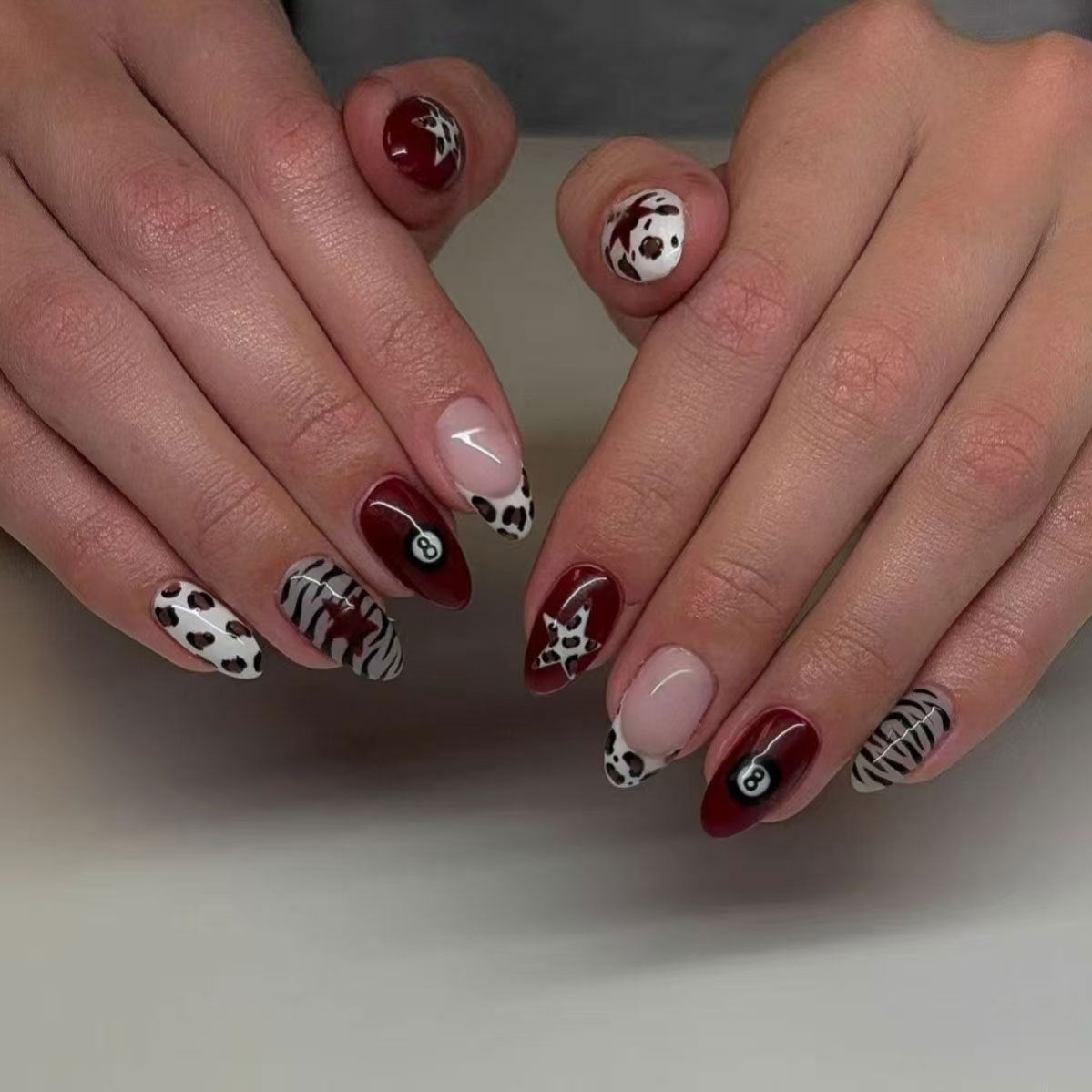 Wild Safari Long Almond Shaped Burgundy and White Animal Print Press on Nail Set with Unique Artistic Designs
