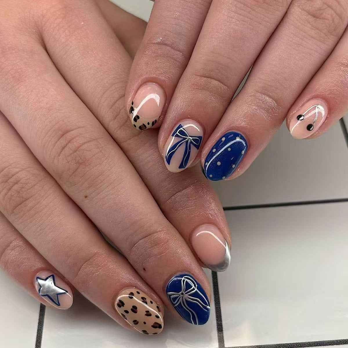 Charming Oceanic Elegance Medium Oval Blue and Neutral Press On Nail Set with Dazzling Bow and Star Accents