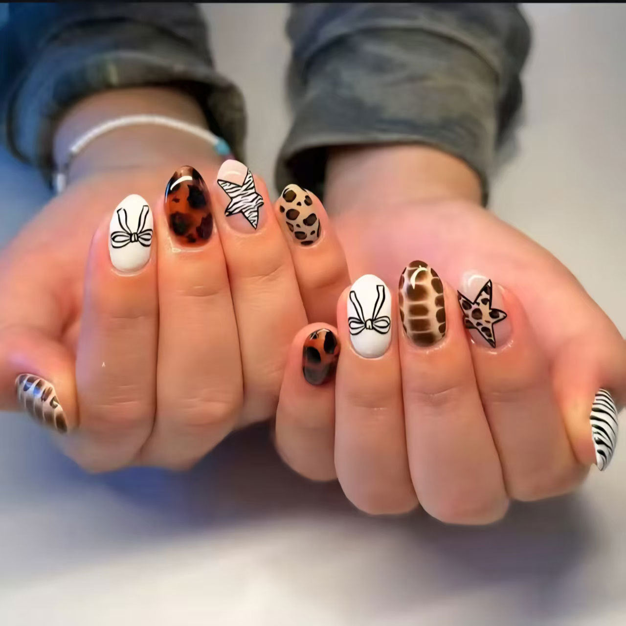 Wild Safari Glamour Medium Oval Multicolored Animal Print and Bow Design Press on Nail Set