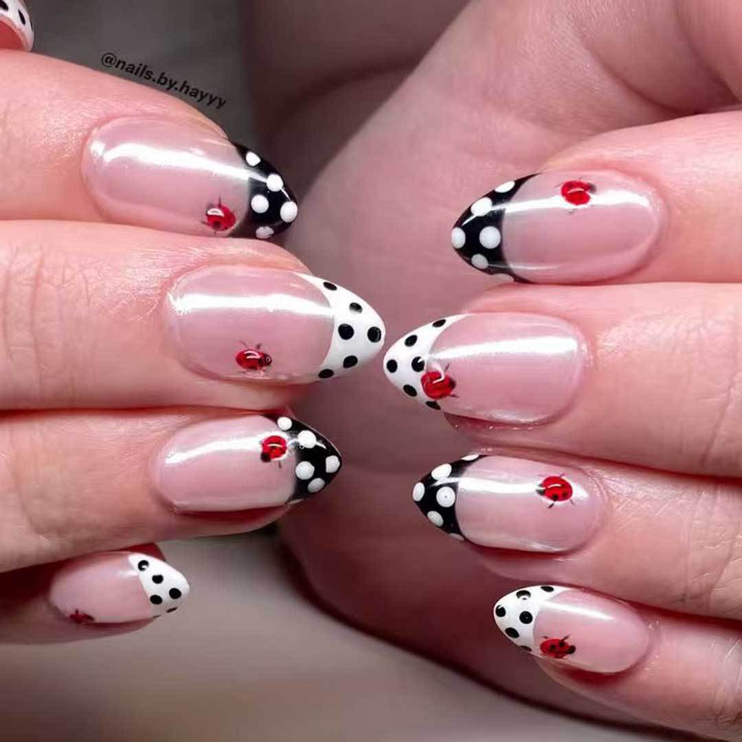 Charming Ladybug Themed Medium Almond Glossy Pink and Black Polka Dot Nail Set with Delicate Floral Accents