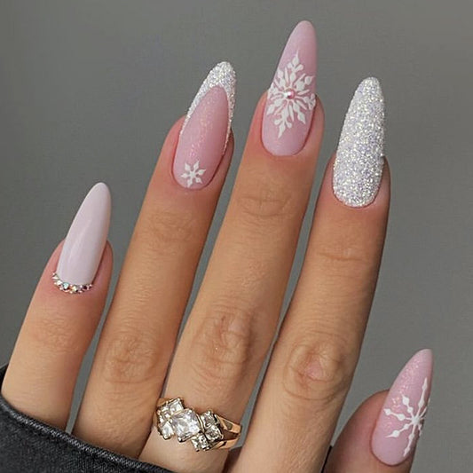 Winter Wonderland Elegant Medium Almond Press On Nail Set in Soft Pink with Shimmering Glitter and Delicate Snowflake Accents