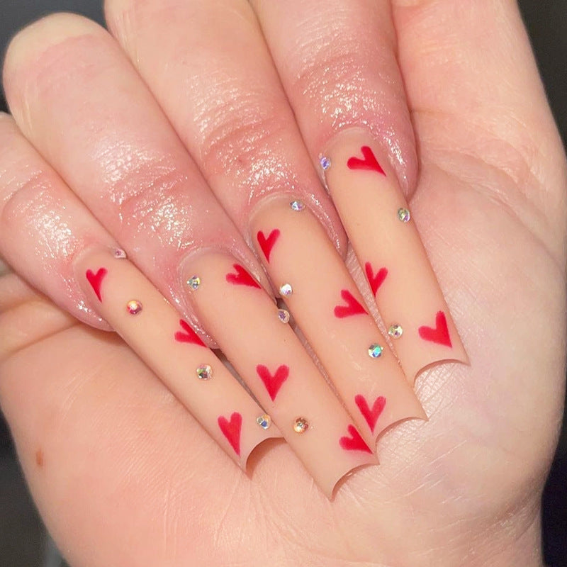 Romantic Heartfelt Long Square Beige Nails with Dazzling Rhinestone Accents
