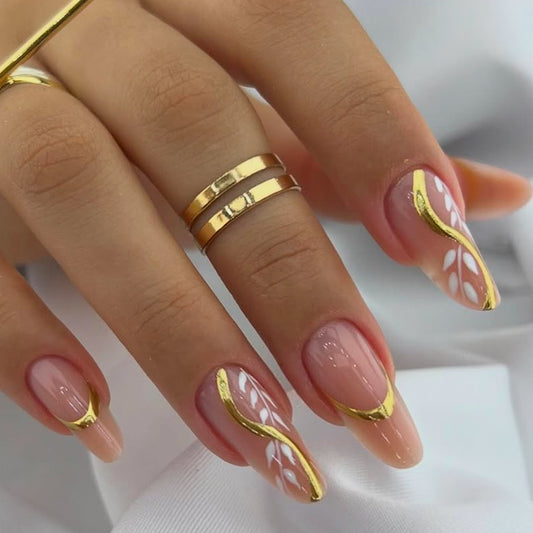 Enchanting Elegance Long Almond Pink Nails with Chic Gold Accents and Unique Floral Design
