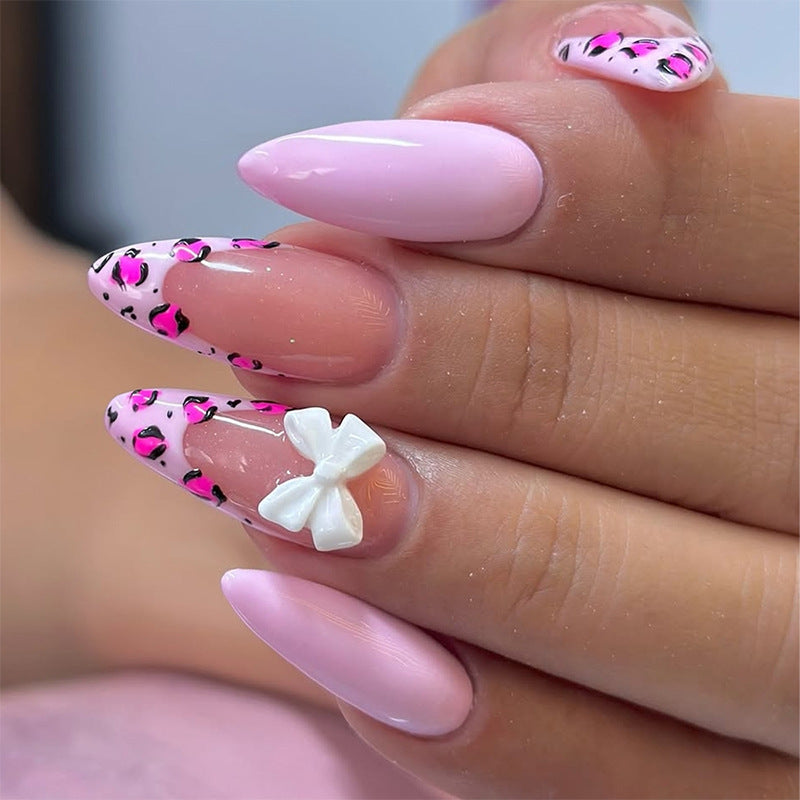 Charming Elegance Medium Almond Shaped Pink Press On Nail Set with Bow Accent and Unique Animal Print Design