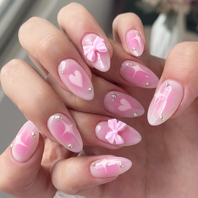 Romantic Blossom Long Almond Pink Press On Nail Set with Heart and Bow Accents Featuring Glittering Gems