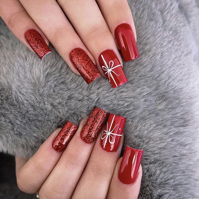 Festive Elegance Medium Square Red Press On Nail Set with Glitter and Charming Bow Detail