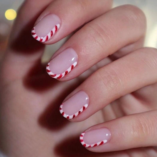 Candy Cane Delight Medium Oval Shaped Pink Press On Nail Set with Whimsical Red Stripe Design