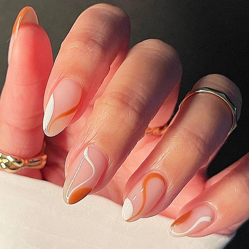 Gourmet Sunset Short Almond Press On Nail Set in Soft Peach with Elegant Swirl Design