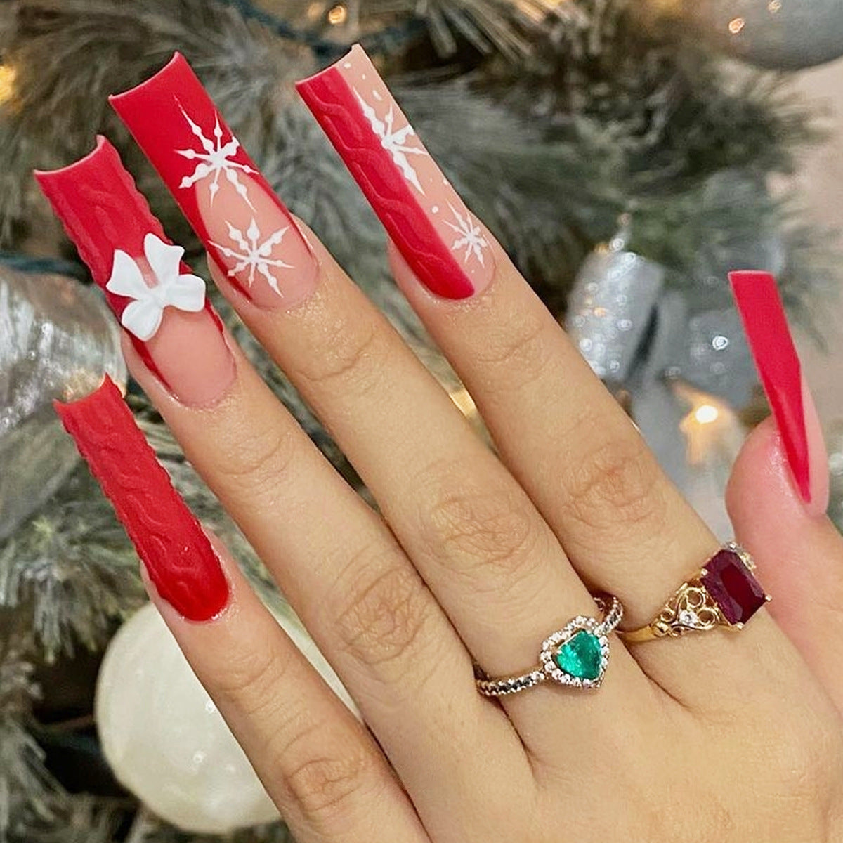 Festive Elegance Long Square Red Nails with Winter Themed Accent and Charming Floral Decoration