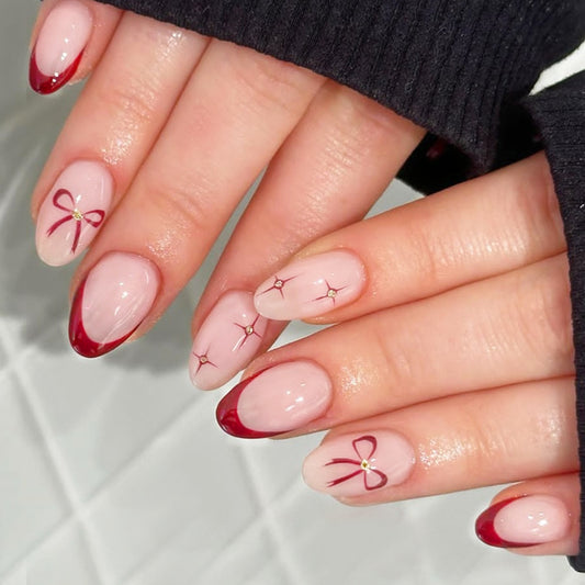 Charming Bow Inspired Short Oval Shaped Pink and Red Press On Nail Set with Unique Ribbon and Gem Accents