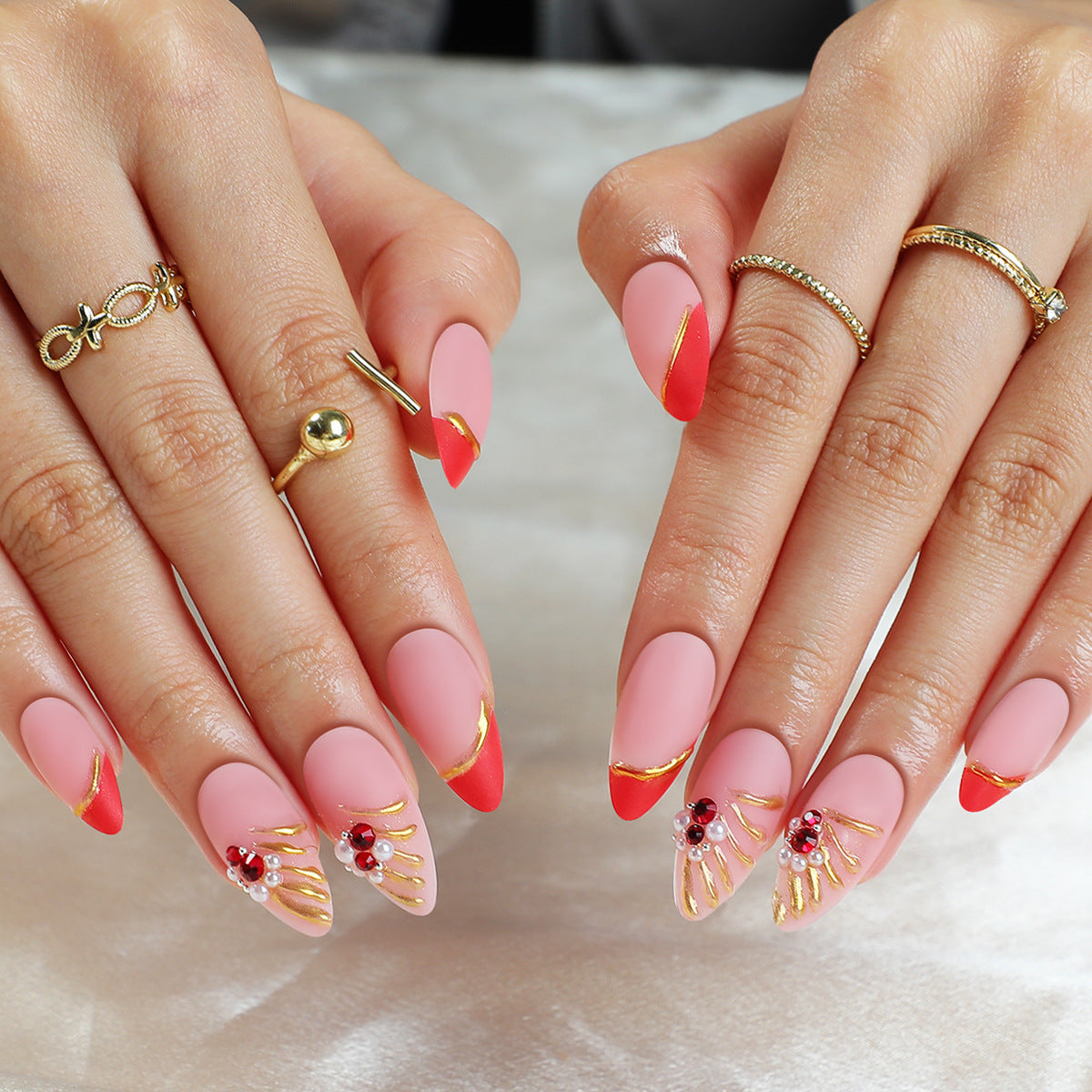 Glamorous Sunset Medium Almond Shaped Pink and Red Press On Nail Set with Rhinestone and Gold Leaf Accents