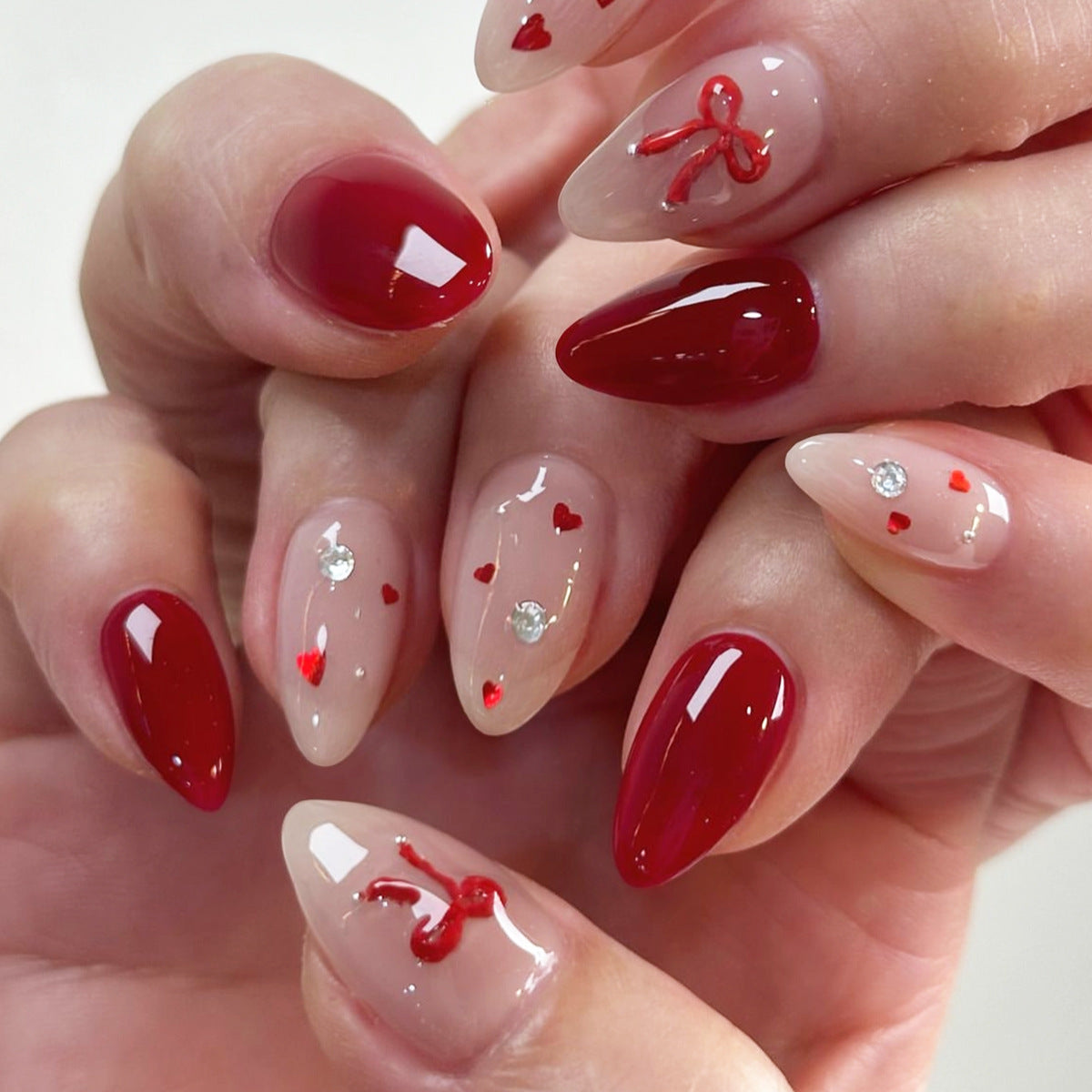 Romantic Charm Short Almond Red and Beige Press On Nail Set with Heart and Bow Accents