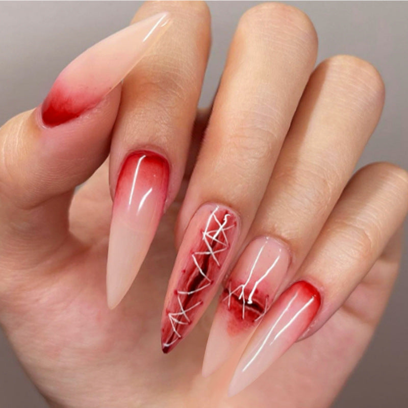 Whimsical Elegance Long Stiletto Ombre Red and Transparent Nails with Intricate White Detailing