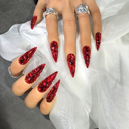 Glamorous Red Stiletto Nails Long Almond Glossy Finish with Sparkling Gem Accents