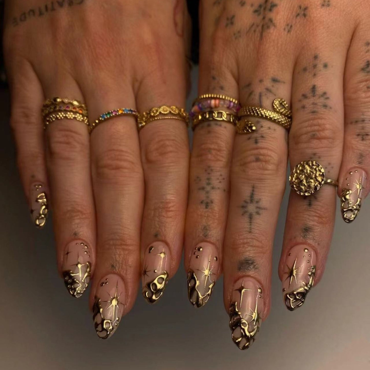 Bohemian EleganceMedium Almond Beige Press On Nails with Gold Embellishments and Celestial Accents