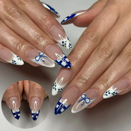Nautical Charm Long Stiletto Press On Nail Set in Blue and White with Elegant Bow Accent and Intricate Floral Design