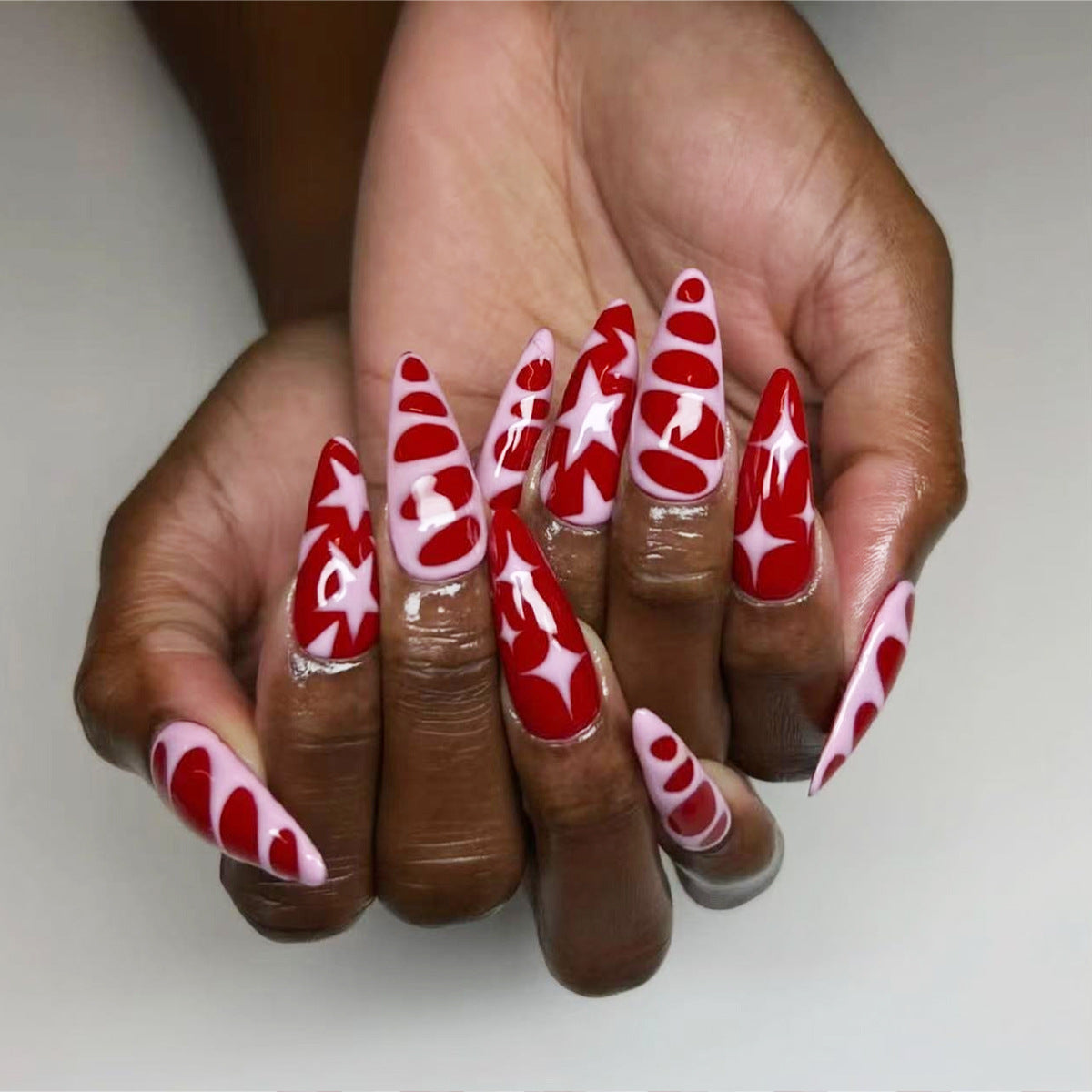Festive Glamour Unique Long Almond Red and Pink Press On Nail Set with Bold Star and Heart Designs