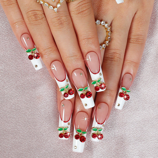 Nails with cherry and leaf decorations on a neutral background