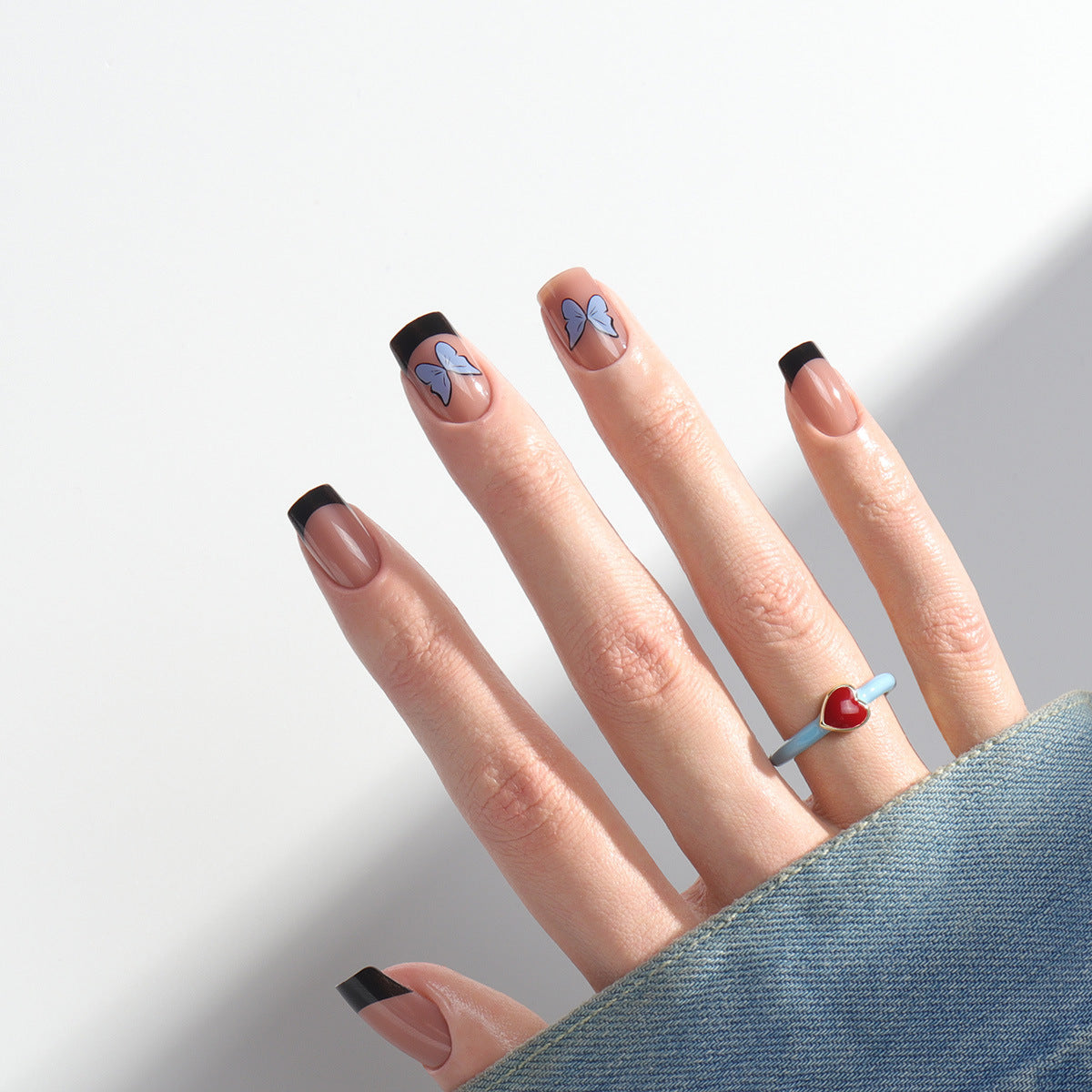 Modern Monarch Medium Square Press On Nails in Beige with Black Tips and Blue Butterfly Accents