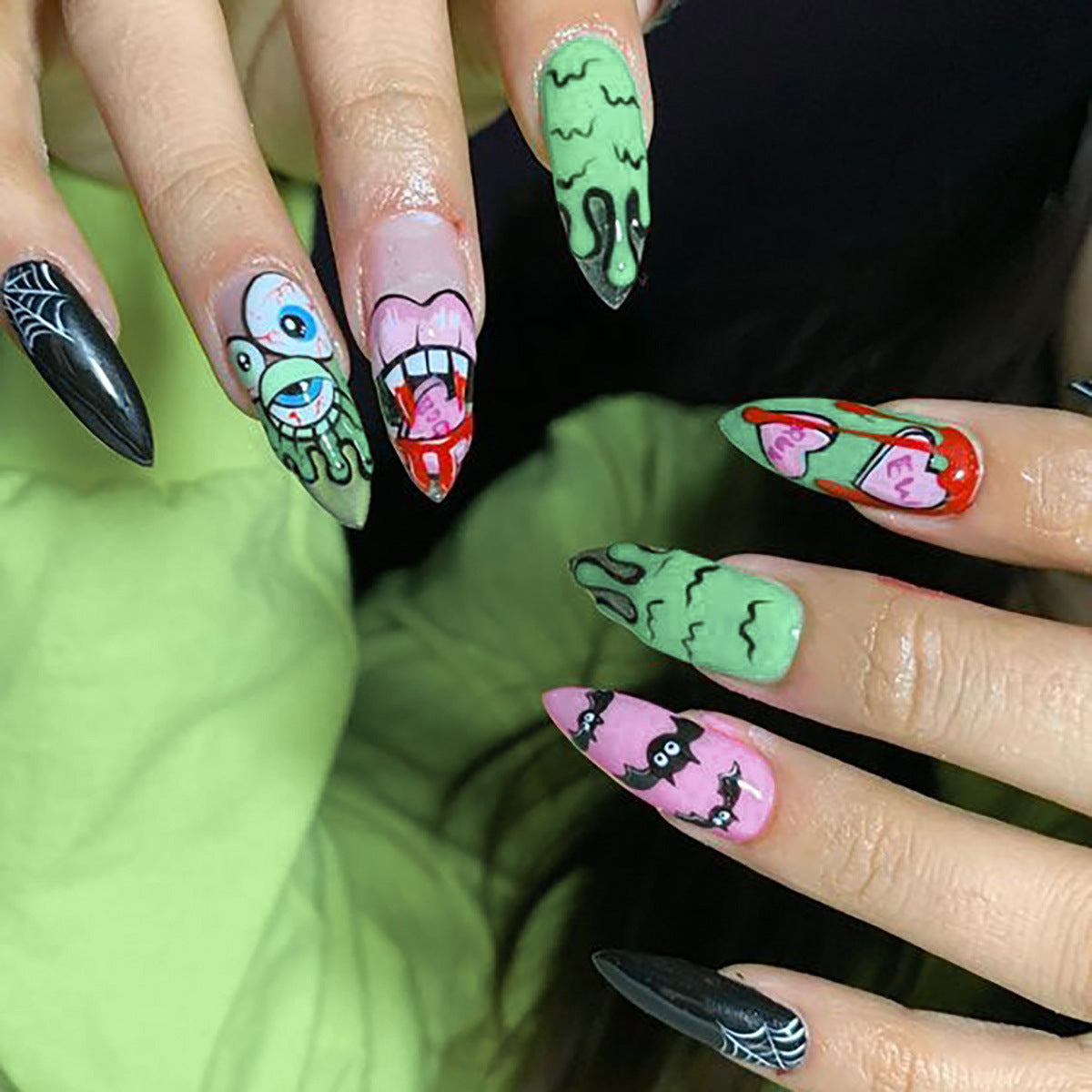 Spooky Halloween Themed Long Almond Press On Nail Set in Green Pink Black Featuring Unique Cartoon Art Designs