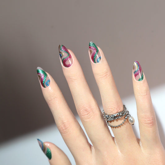 Hand with colorful nail art on a neutral background