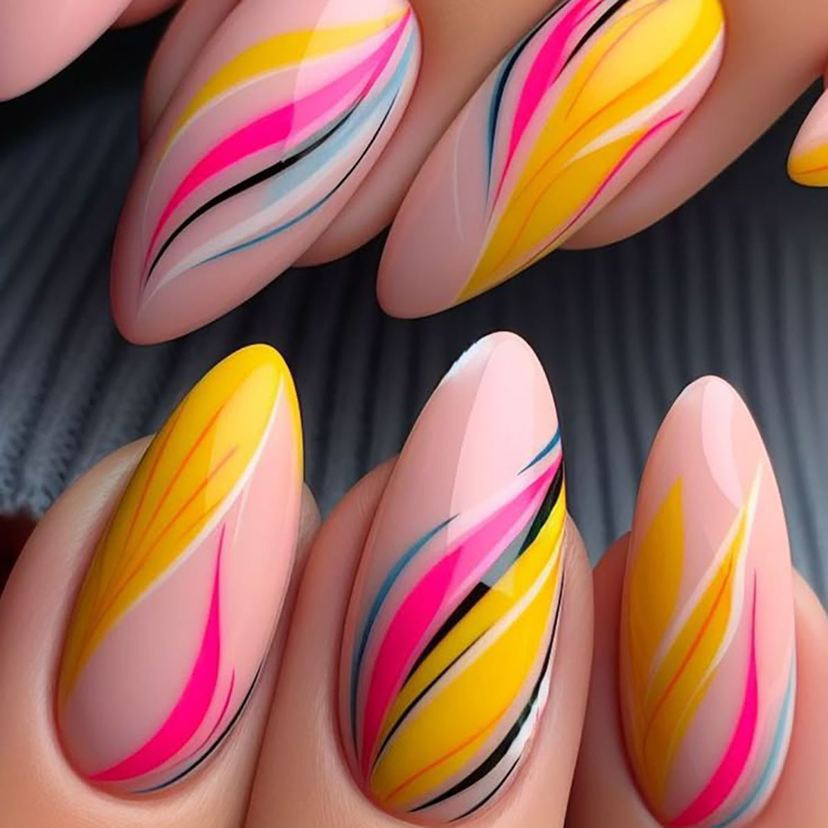 Tropical Bliss Medium Almond Shaped Press On Nail Set in Vibrant Yellow and Pink with Elegant Swirl Design