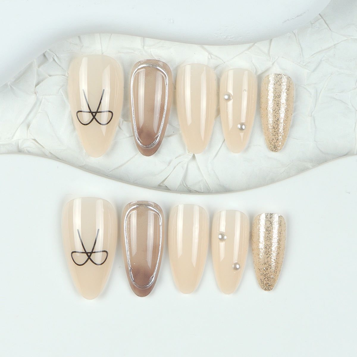Elegant Serenity Medium Almond Beige Press On Nail Set with Unique Metallic Accent