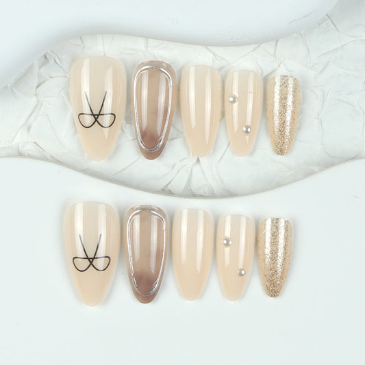 Elegant Serenity Medium Almond Beige Press On Nail Set with Unique Metallic Accent