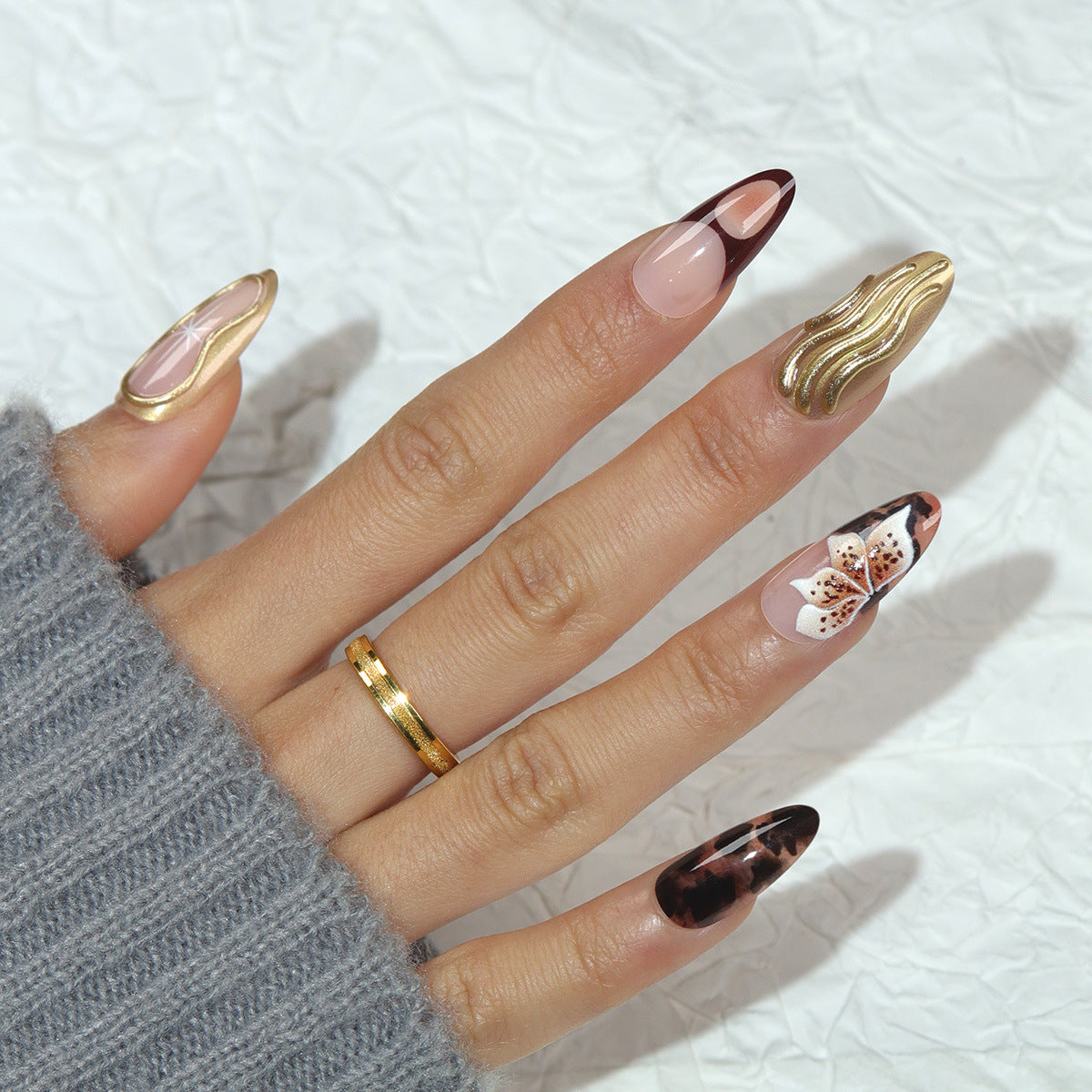 Enchanting Elegance Long Almond Brown and Pink Nail Set with Unique Golden Wave Design