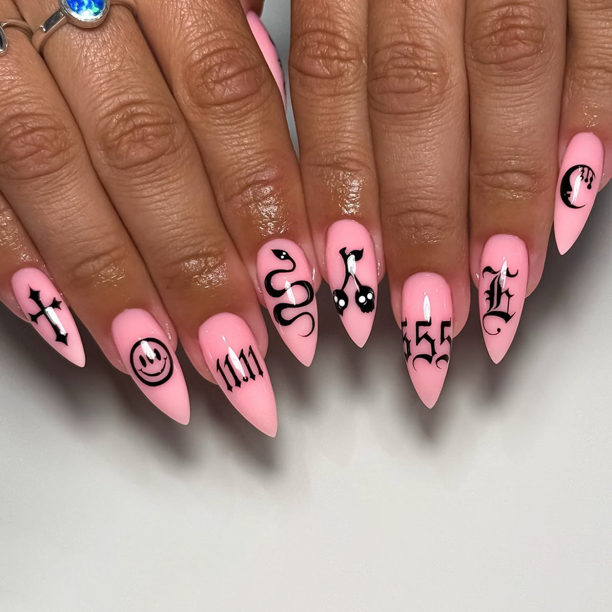 Charming Whimsical Long Stiletto Pink Press On Nail Set Featuring Unique Symbols and Designs