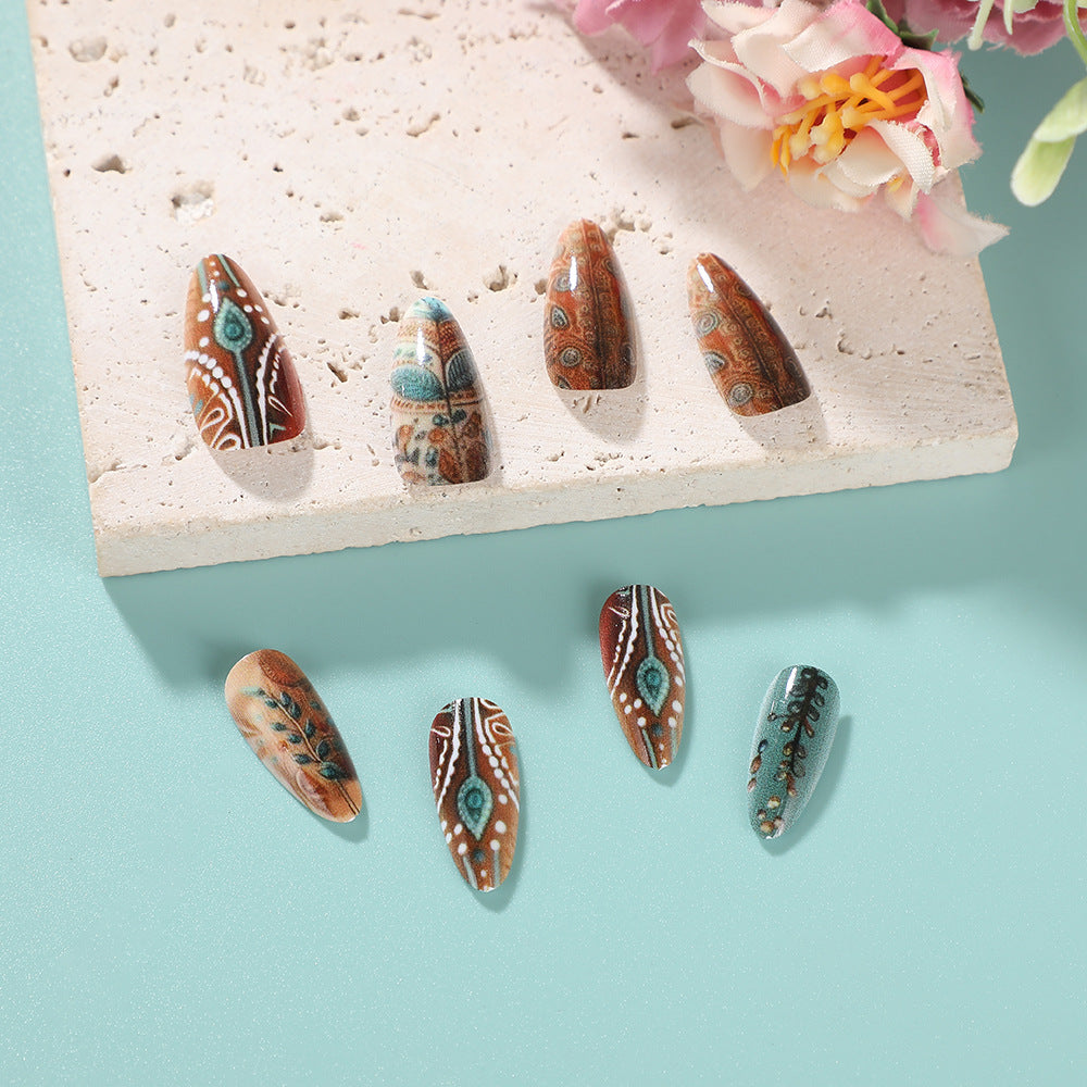 Bohemian Charm Short Almond Shaped Brown and Green Press On Nail Set with Intricate Cultural Patterns